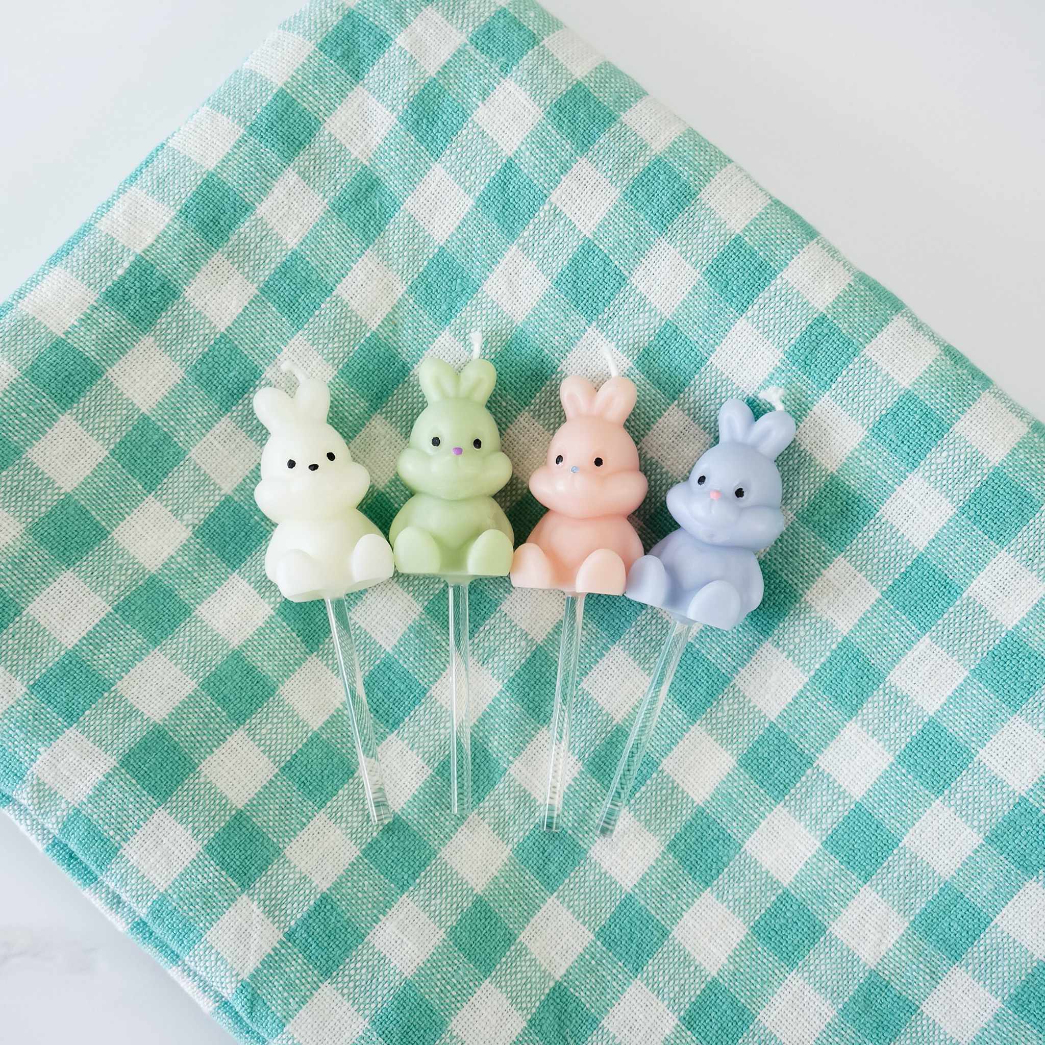 bunny birthday candles on a dishcloth