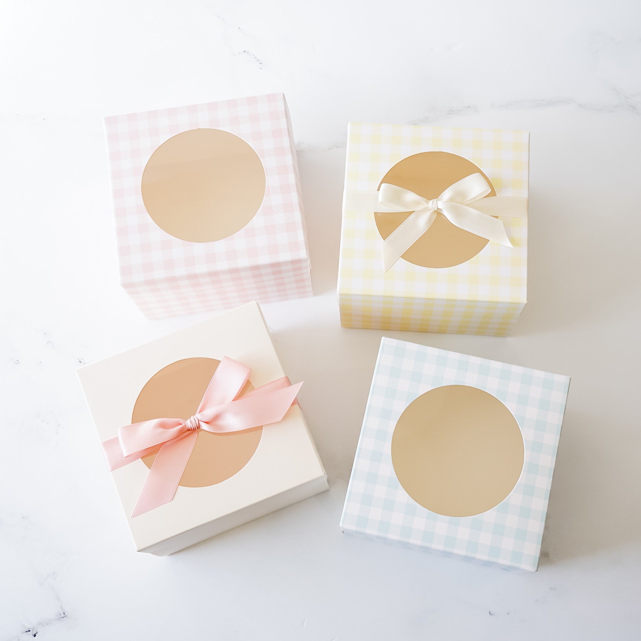 cookie boxes in ivory, pink, blue and yellow