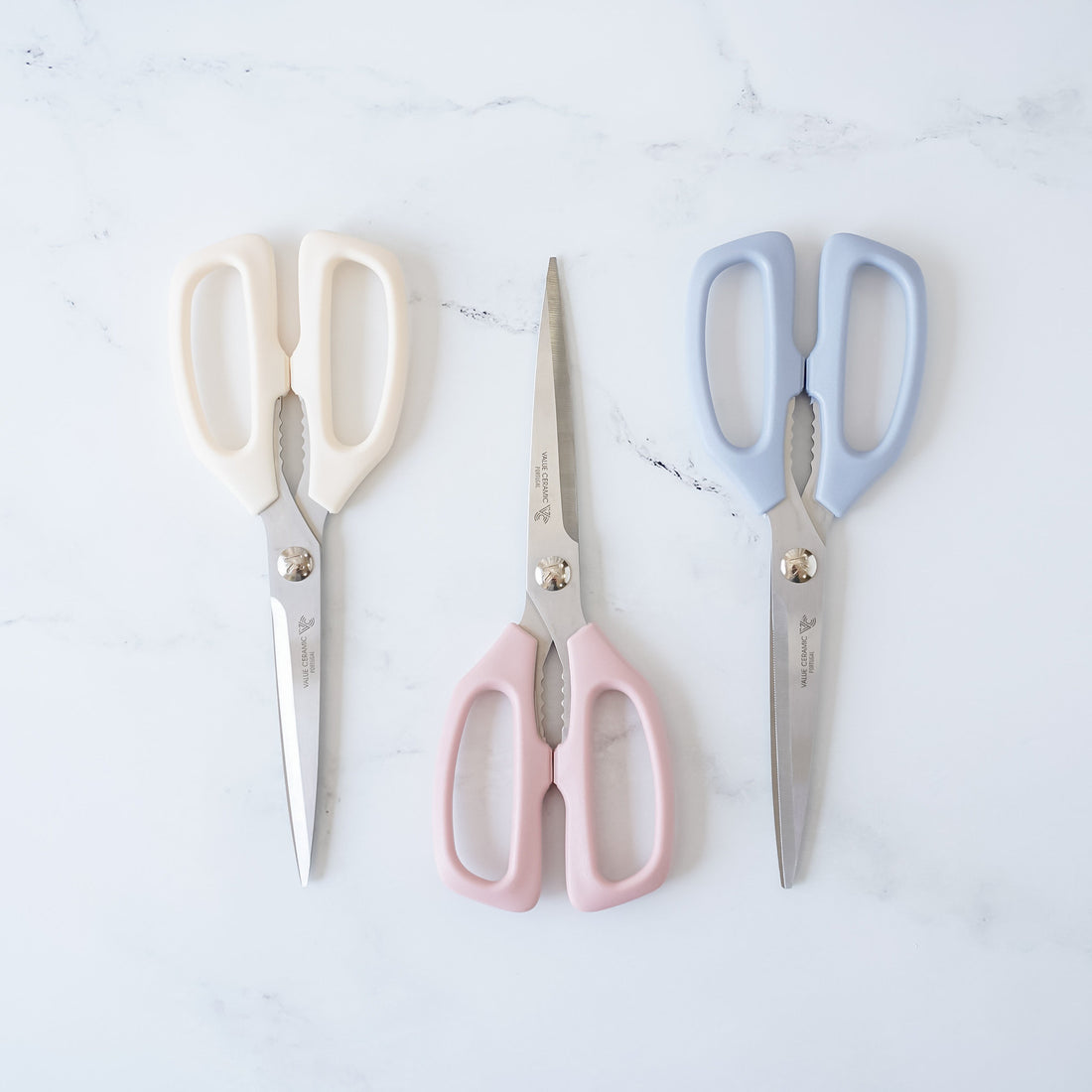 kitchen scissors in ivory, pink, and blue