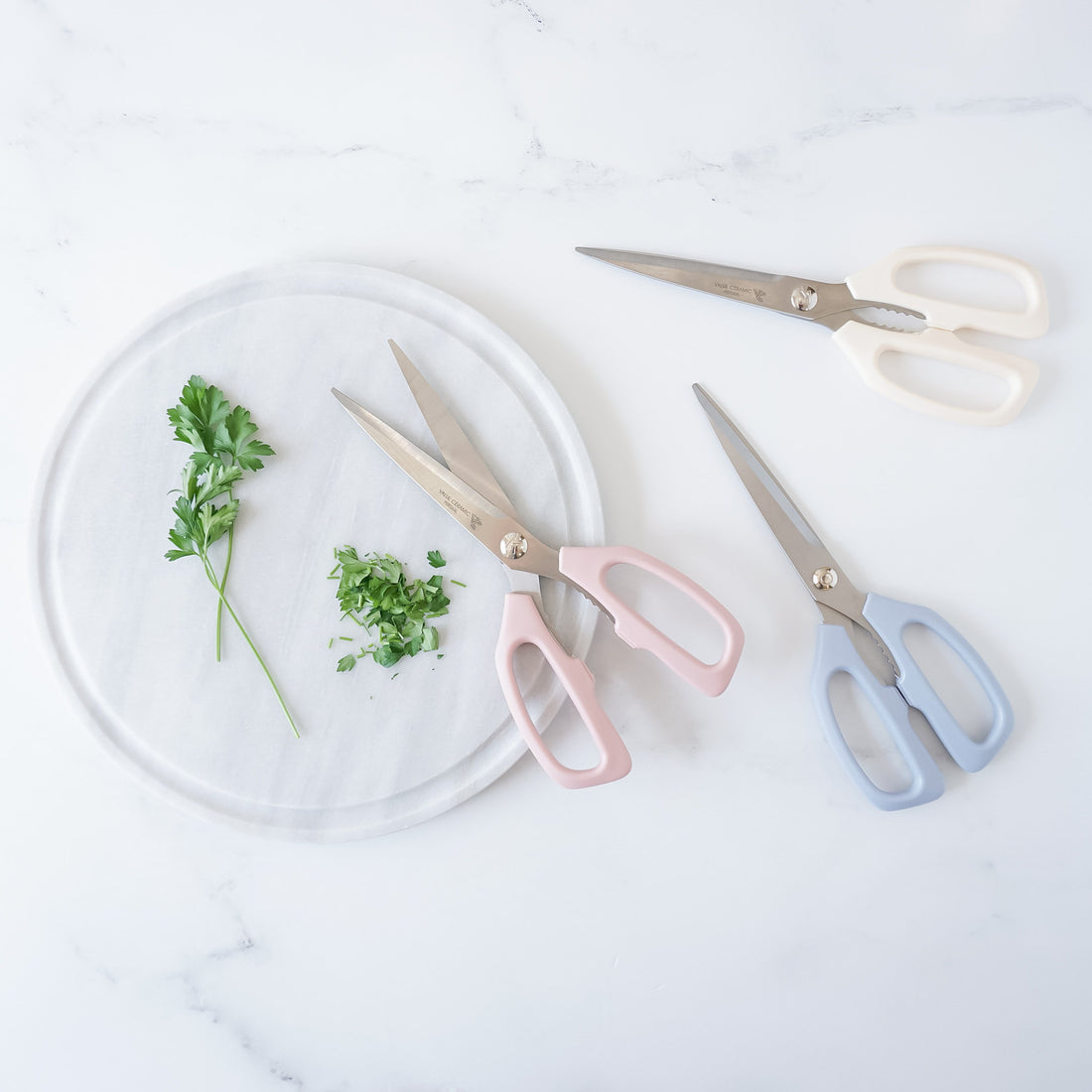 kitchen shears in ivory, pink, and blue