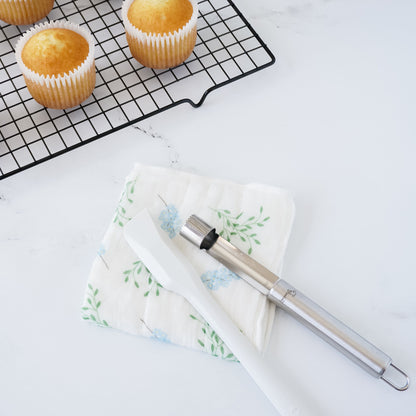 kitchen towel, spatula, cup cakes