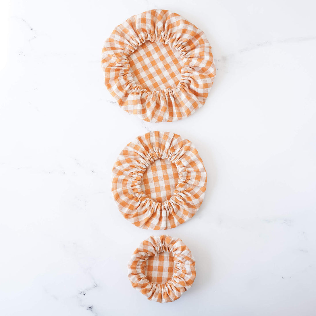 linen dish covers in pumpkin check