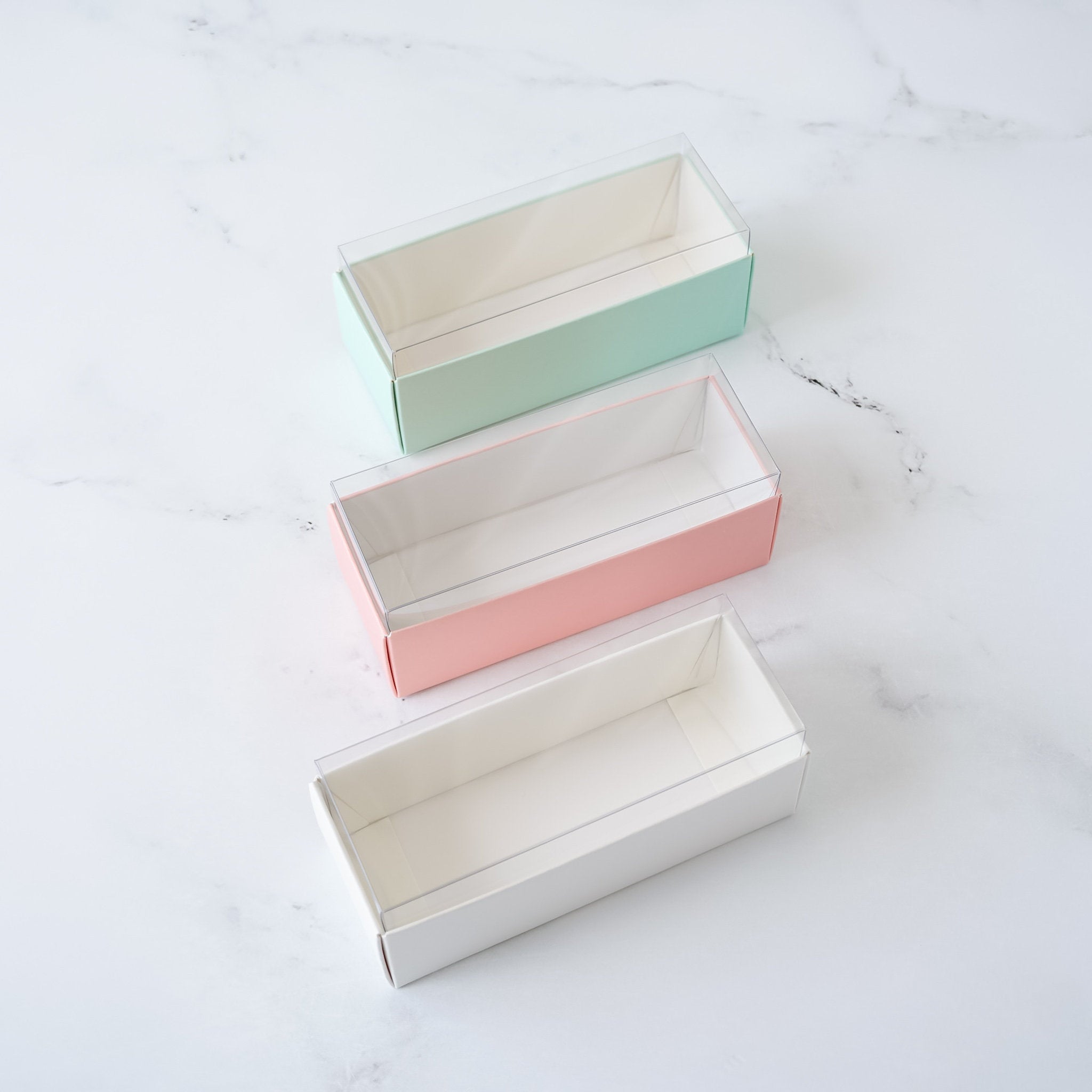 macaron boxes in white, pink, and mint