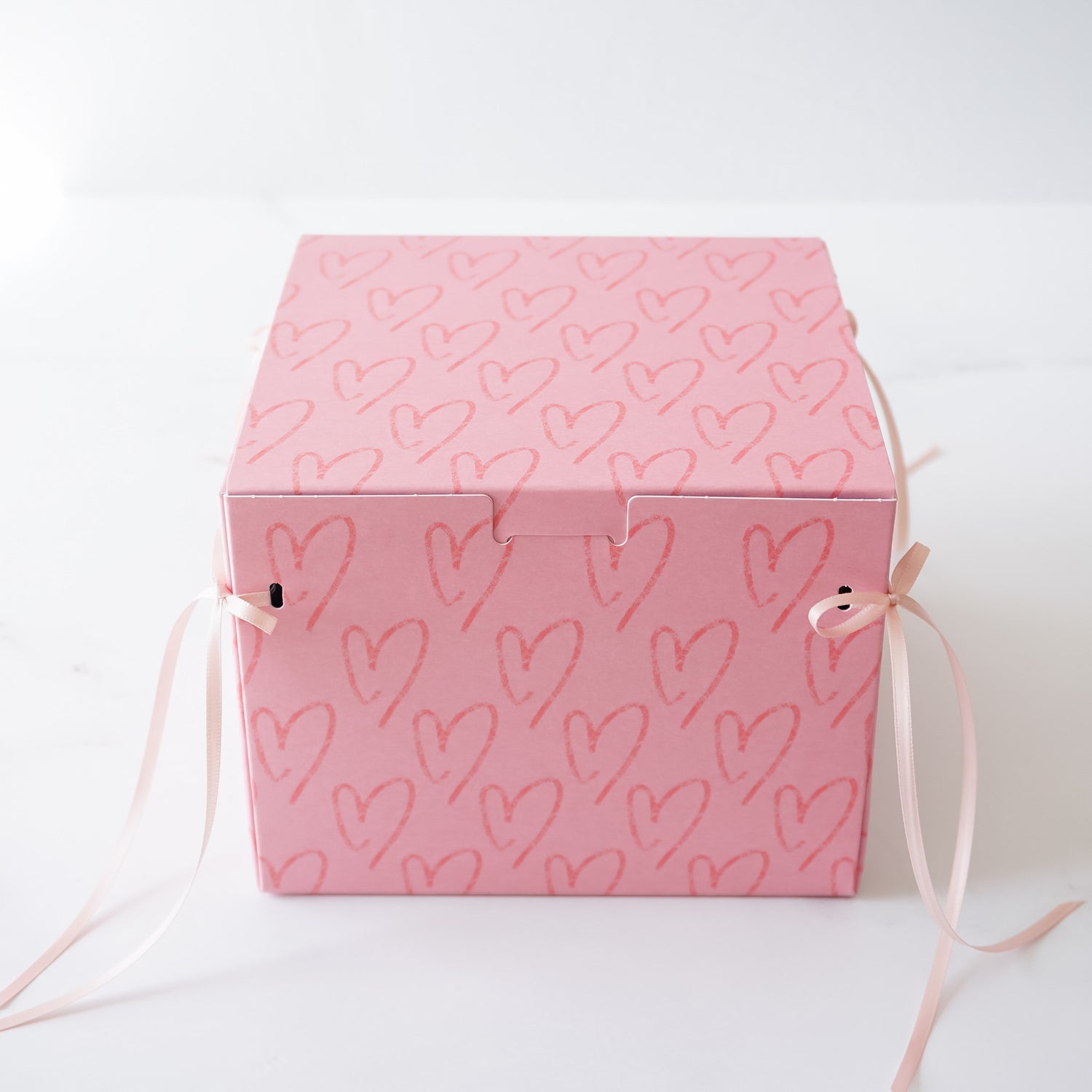 pink cookie box with pink ribbon bow