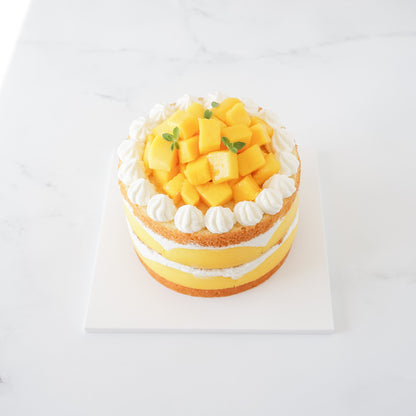 mango cake, white cake board