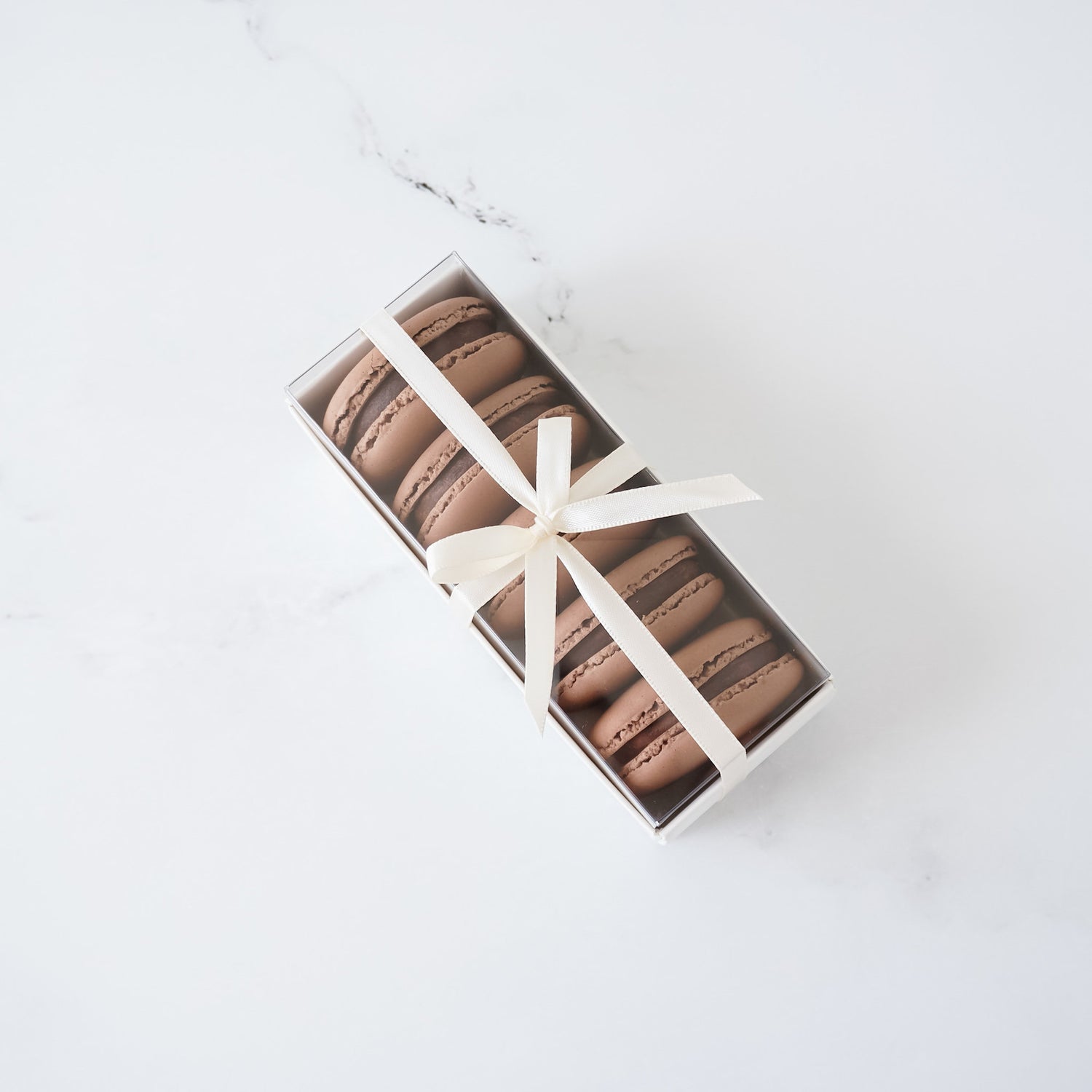 white macaron box with clear lid in small